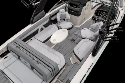 Chaparral 26 SURF table mounted on the port side with two cupholders and metal hardware. 