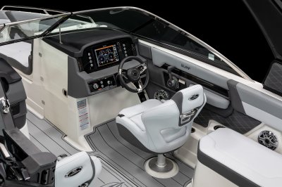 Chaparral 26 SURF helm has a captain's chair with flip-up bolster and cushioned bolster pads. 