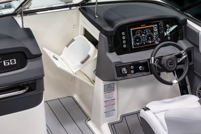 Chaparral 26 SURF helm console has a storage compartment built in the bow walkway. 